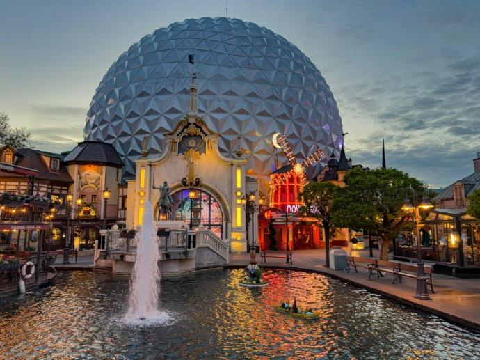 A beautiful building and fountain at nighttime